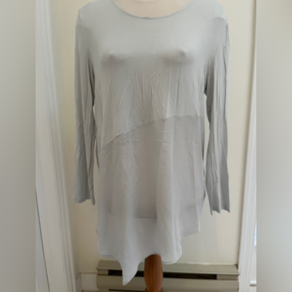 DKNY ladies top size large, upper and lower sheer.